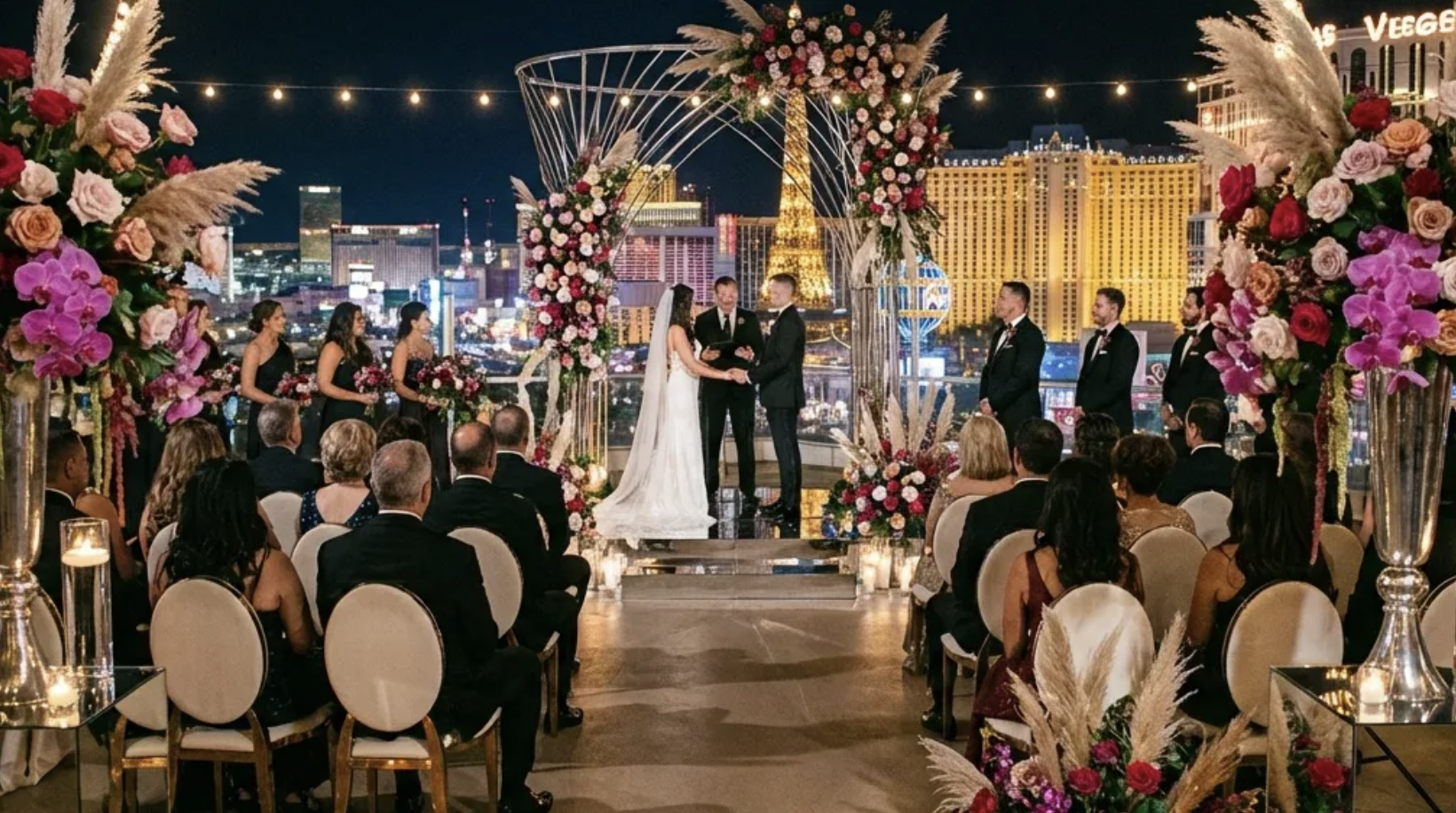 Rooftop las vegas wedding overseeing the las vegas strip and a view of the eiffel tower.